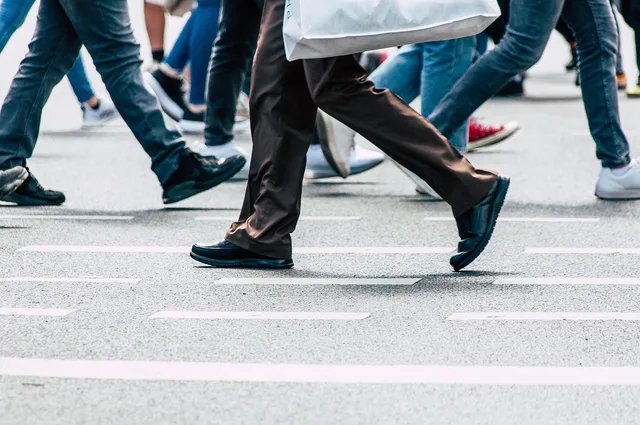 pedestrian, feet, steps, people, road, people, people, people, people, people. Choosing a location from employee travel needs